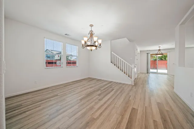 a view of livingroom with hardwood floor and a ceiling fan