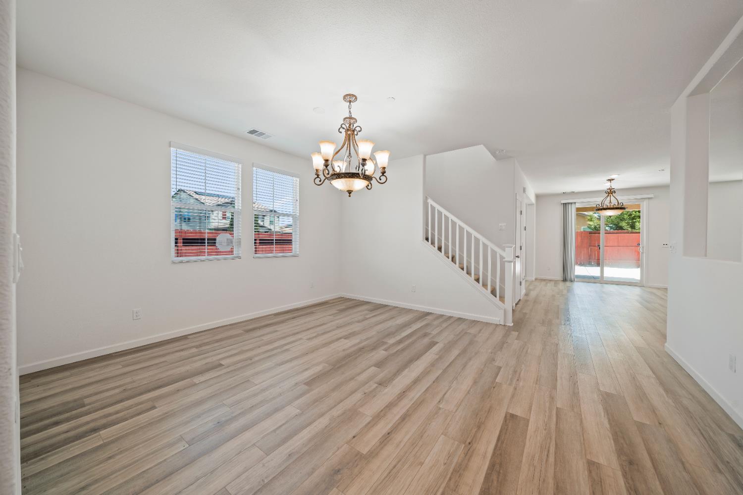 1602 Oleander Avenue Manteca, CA 95337 - Photo 11 of 52 a view of livingroom with hardwood floor and a ceiling fan