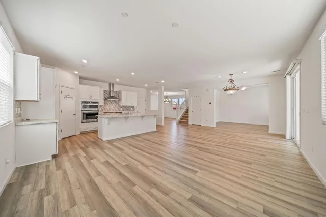 a view of kitchen view wooden floor and window