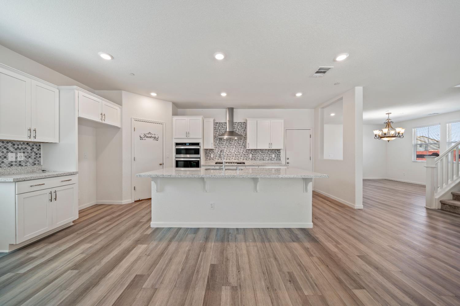 1602 Oleander Avenue Manteca, CA 95337 - Photo 19 of 52 a view of kitchen with wooden floor and electronic appliances