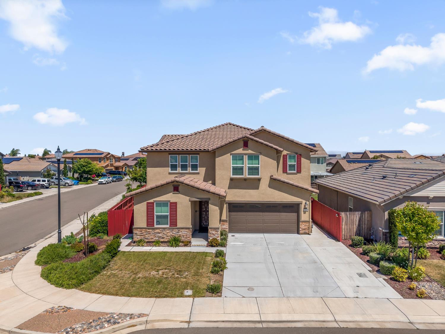 1602 Oleander Avenue Manteca, CA 95337 - Photo 2 of 52 a front view of a house with a yard