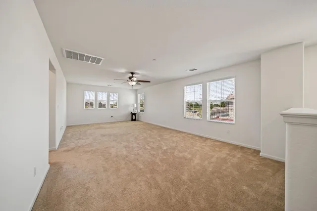 a view of a livingroom with wooden floor and a window