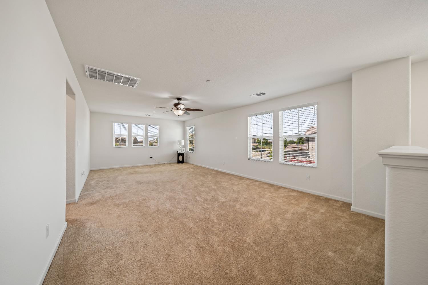 1602 Oleander Avenue Manteca, CA 95337 - Photo 23 of 52 a view of a livingroom with wooden floor and a window