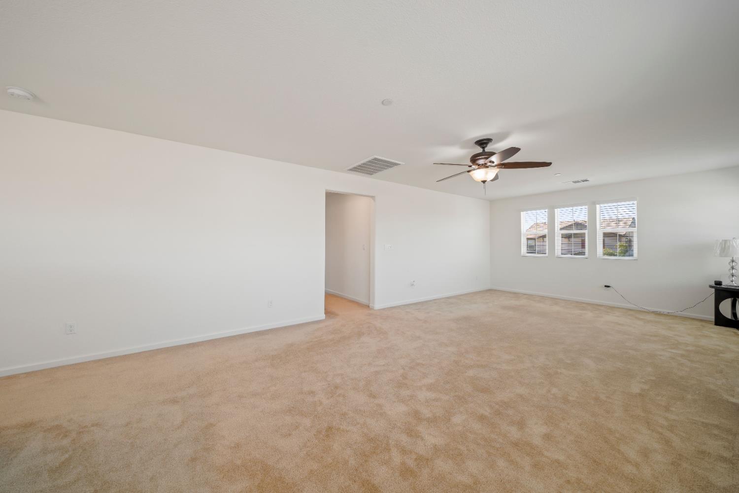 1602 Oleander Avenue Manteca, CA 95337 - Photo 25 of 52 a view of a livingroom with a fan