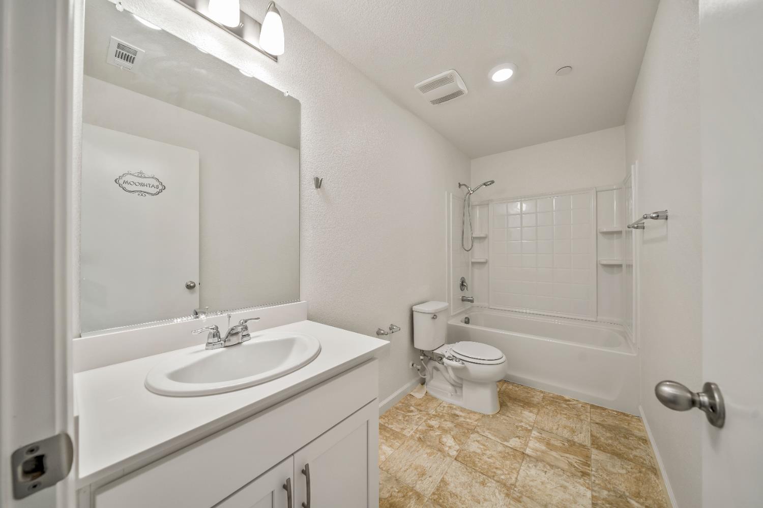 1602 Oleander Avenue Manteca, CA 95337 - Photo 26 of 52 a bathroom with a sink toilet and a mirror