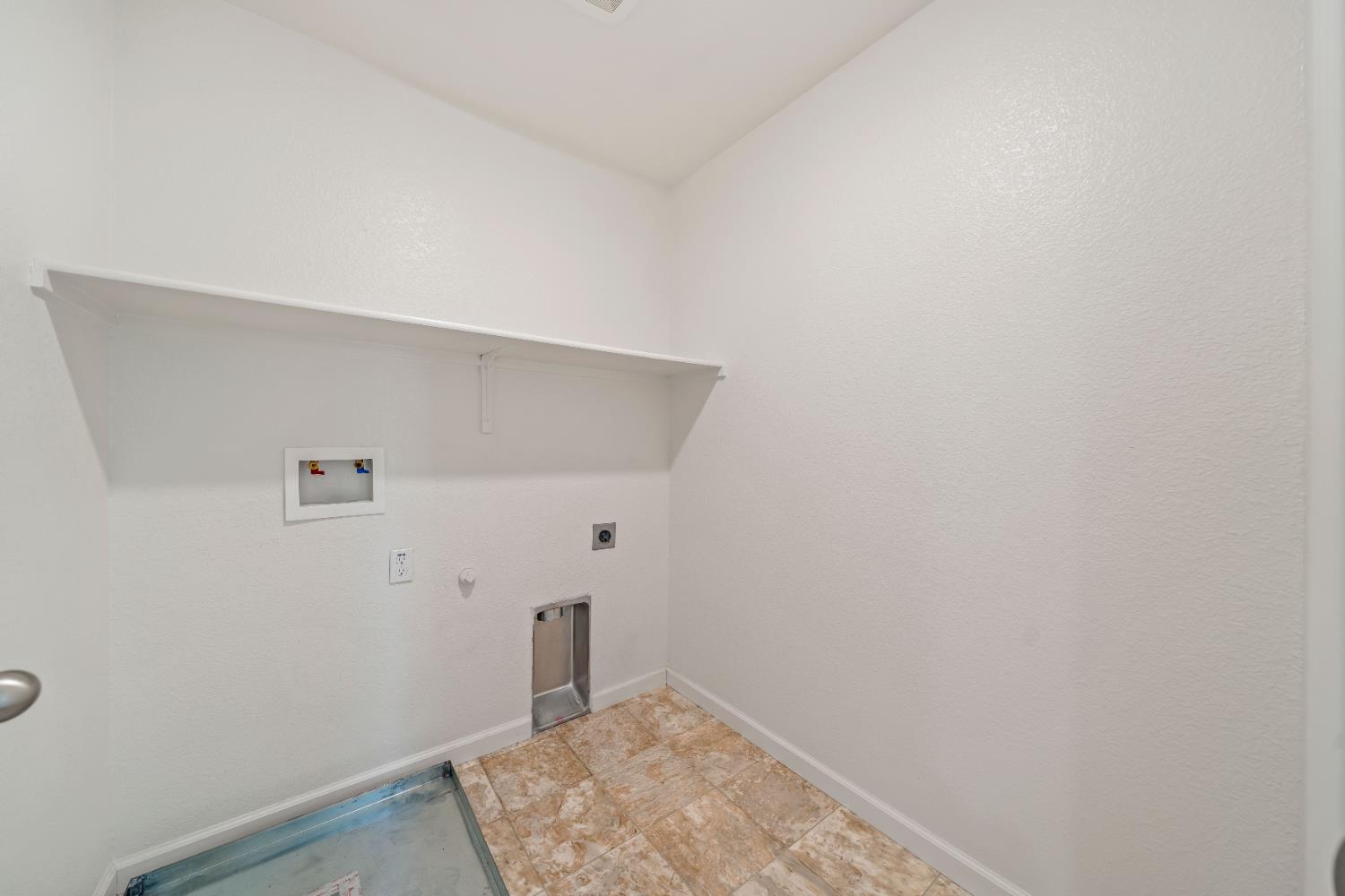 1602 Oleander Avenue Manteca, CA 95337 - Photo 27 of 52 a view of small space with racks on the wall