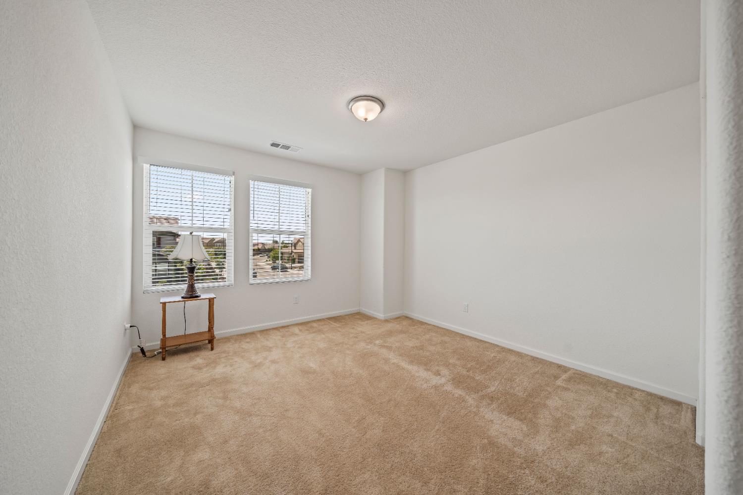 1602 Oleander Avenue Manteca, CA 95337 - Photo 28 of 52 a view of an empty room with a window