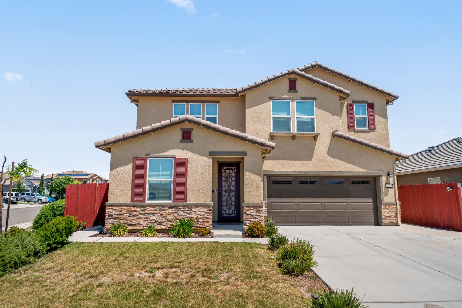 1602 Oleander Avenue Manteca, CA 95337 - Photo 3 of 52 a front view of a house with a yard