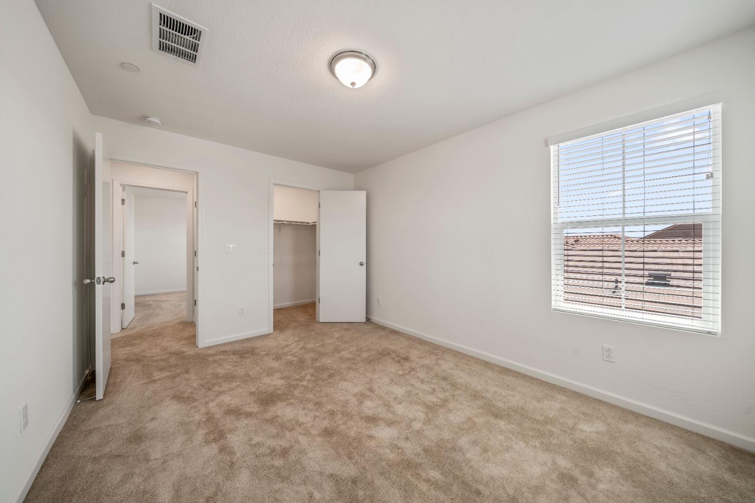 1602 Oleander Avenue Manteca, CA 95337 - Photo 31 of 52 a view of an empty room with a window
