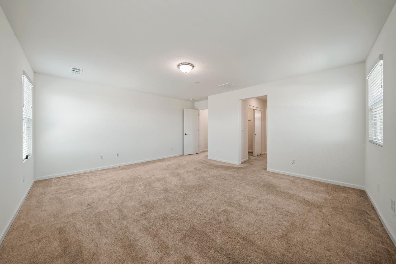 1602 Oleander Avenue Manteca, CA 95337 - Photo 35 of 52 a view of an empty room with a window