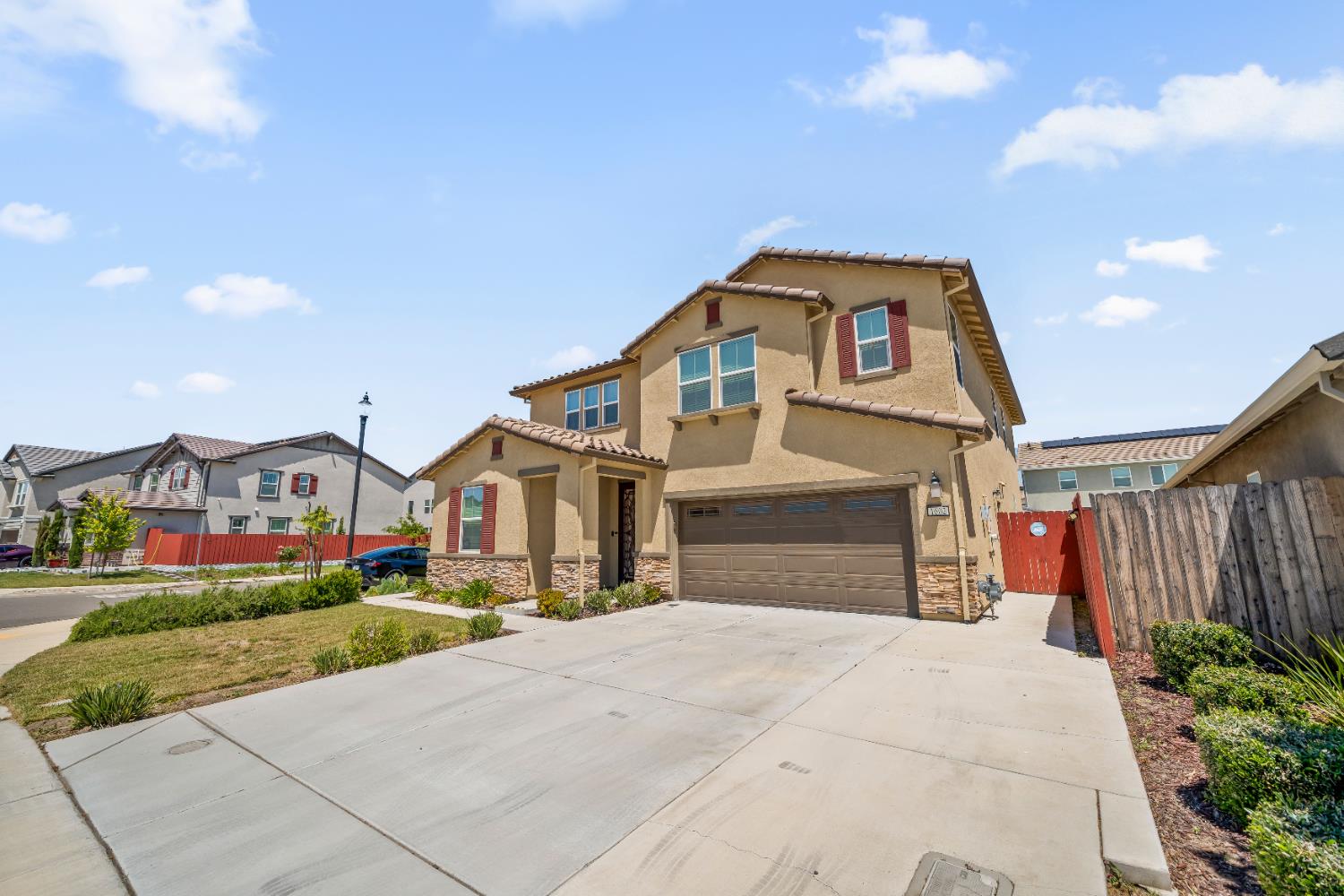 1602 Oleander Avenue Manteca, CA 95337 - Photo 4 of 52 a front view of a house with a yard