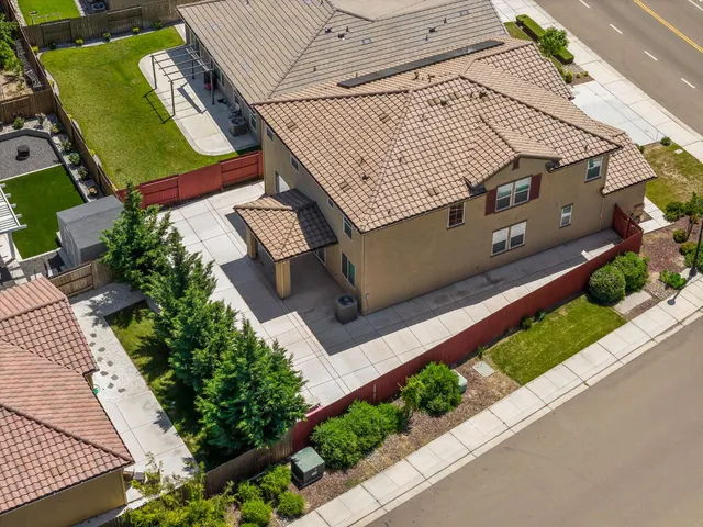 an aerial view of a house with a ocean view
