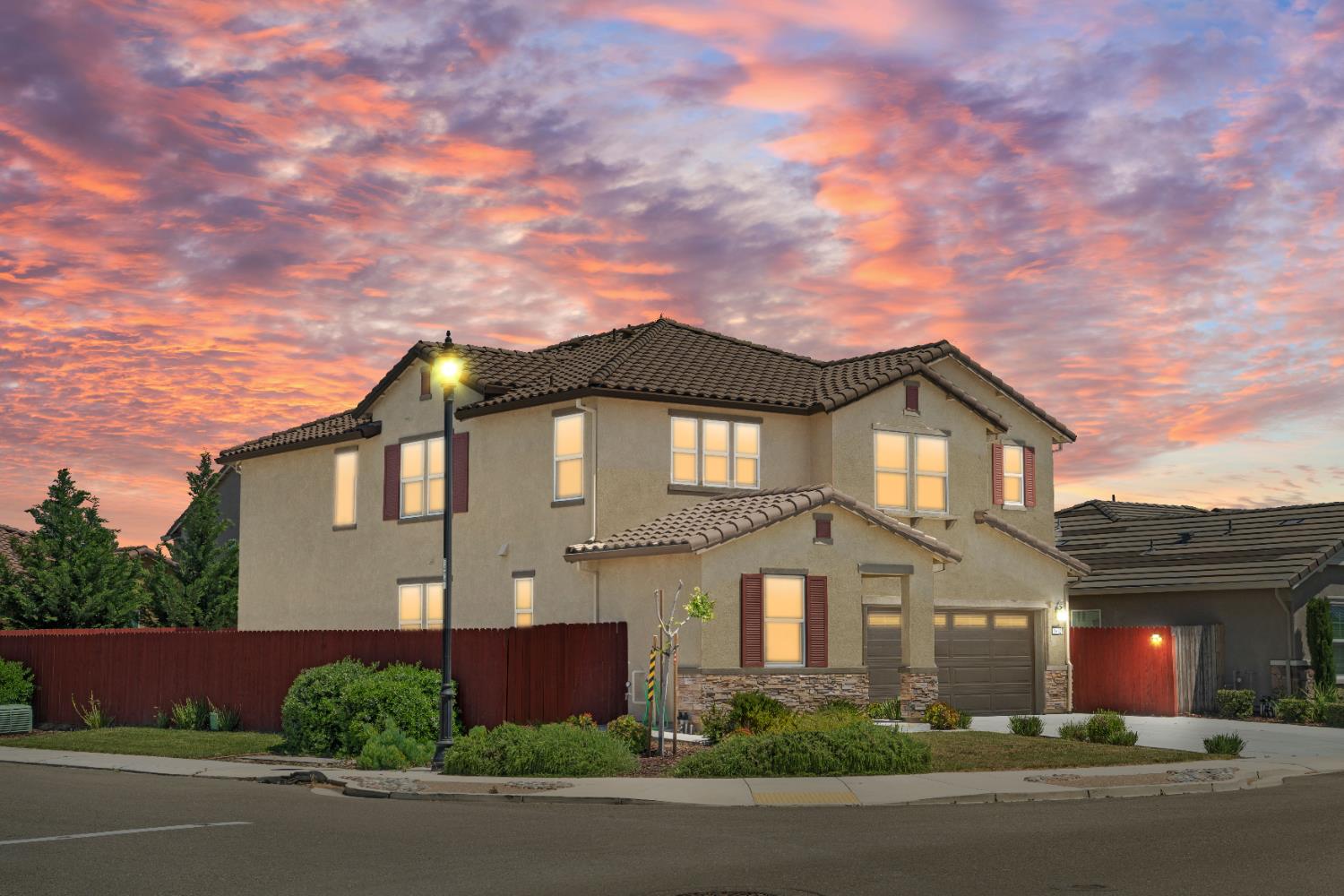 1602 Oleander Avenue Manteca, CA 95337 - Photo 6 of 52 front view of a house with a yard