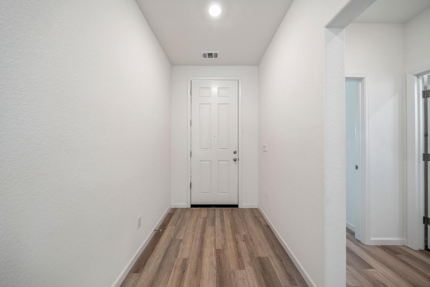 1602 Oleander Avenue Manteca, CA 95337 - Photo 7 of 52 a view of a room with wooden floor