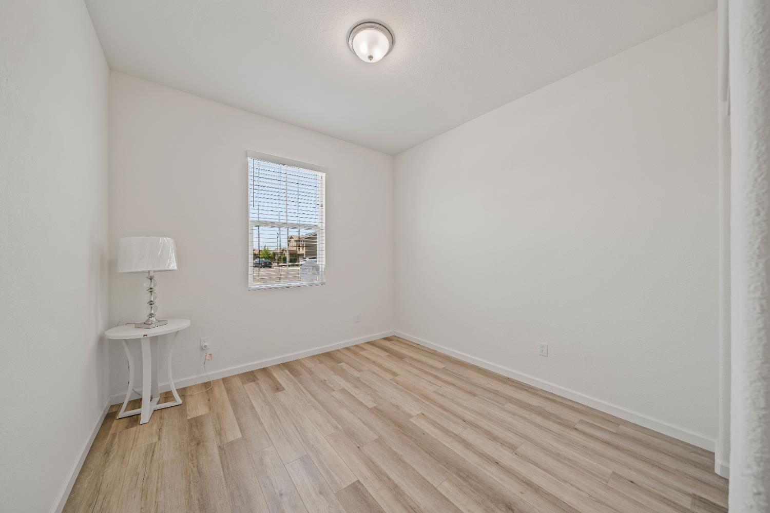 1602 Oleander Avenue Manteca, CA 95337 - Photo 9 of 52 an empty room with a window
