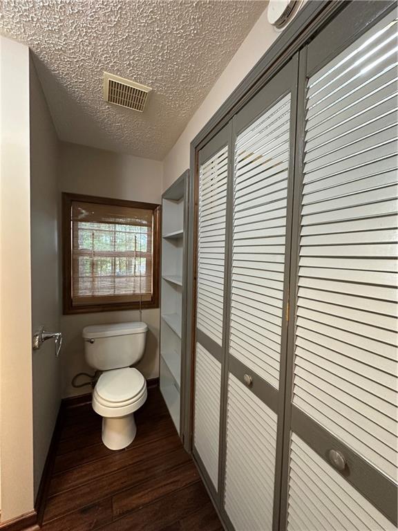 710 Spiva Road Temple, GA 30179 - Photo 25 of 31 a bathroom with a toilet a sink and mirror