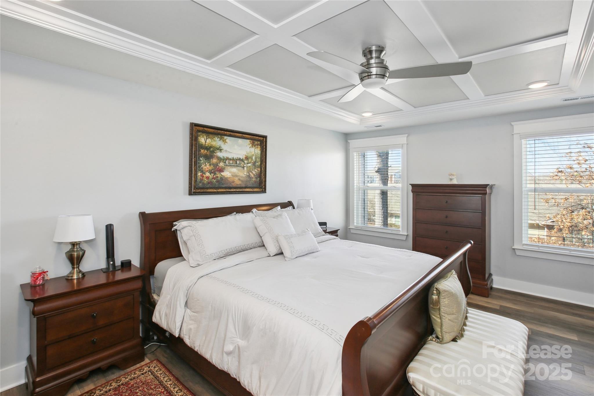 2126 Bexar Trail Matthews, NC 28105 - Photo 11 of 12 a bedroom with a bed and wooden floor