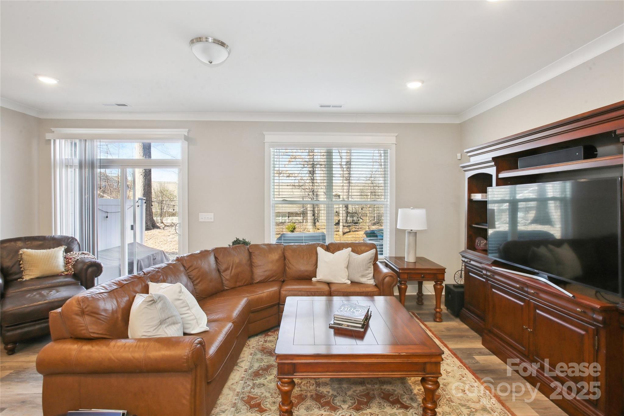 2126 Bexar Trail Matthews, NC 28105 - Photo 4 of 12 a living room with furniture and a flat screen tv