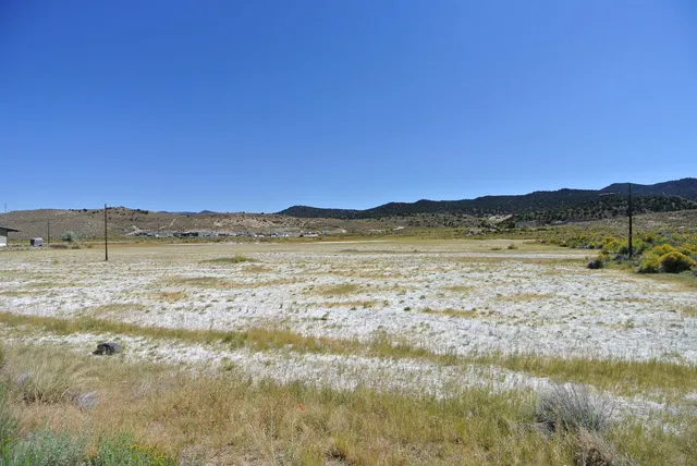 a view of an empty room with a floor to ceiling window