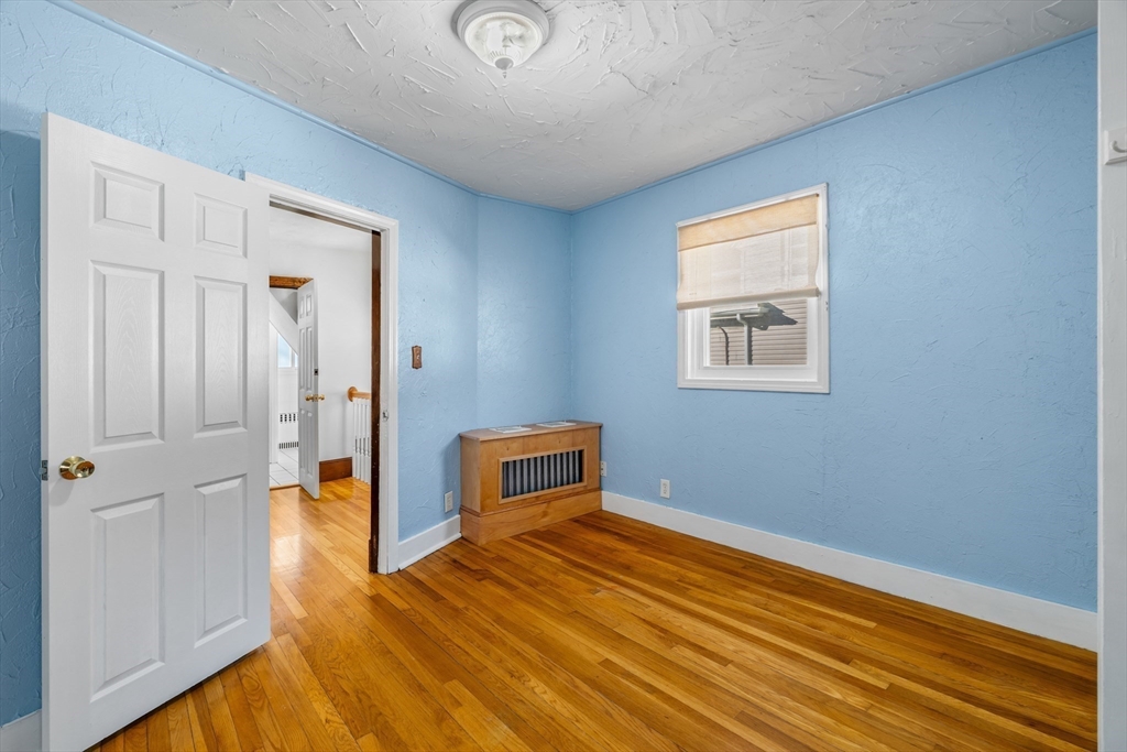 32 Beach Street Malden, MA 02148 - Photo 16 of 31 a view of a livingroom with wooden floor