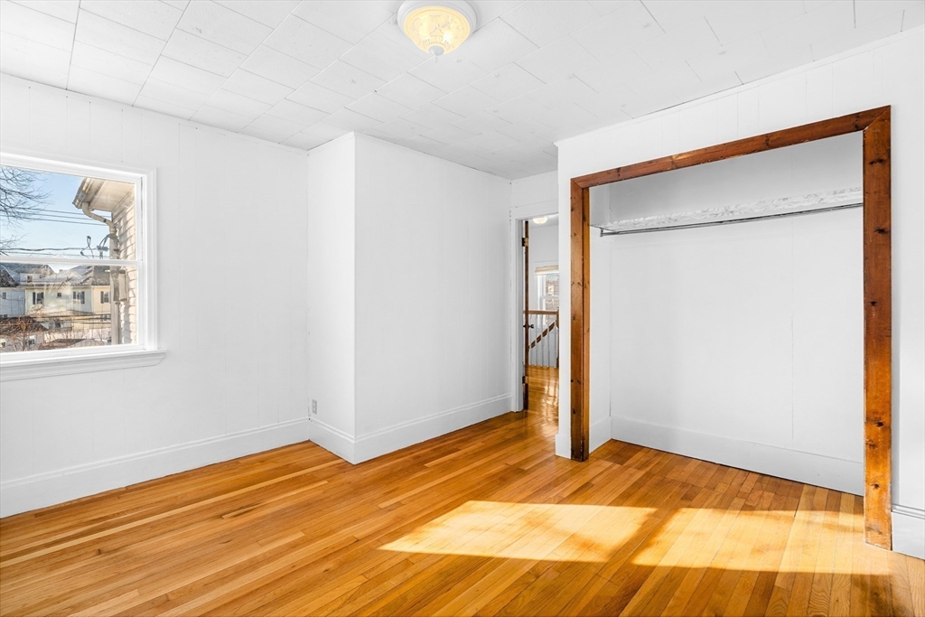 32 Beach Street Malden, MA 02148 - Photo 18 of 31 a view of a room with wooden floor and bathroom