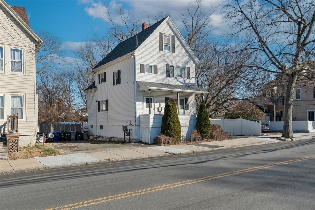32 Beach Street Malden, MA 02148 - Photo 2 of 31 a view of a white building among the street and trees