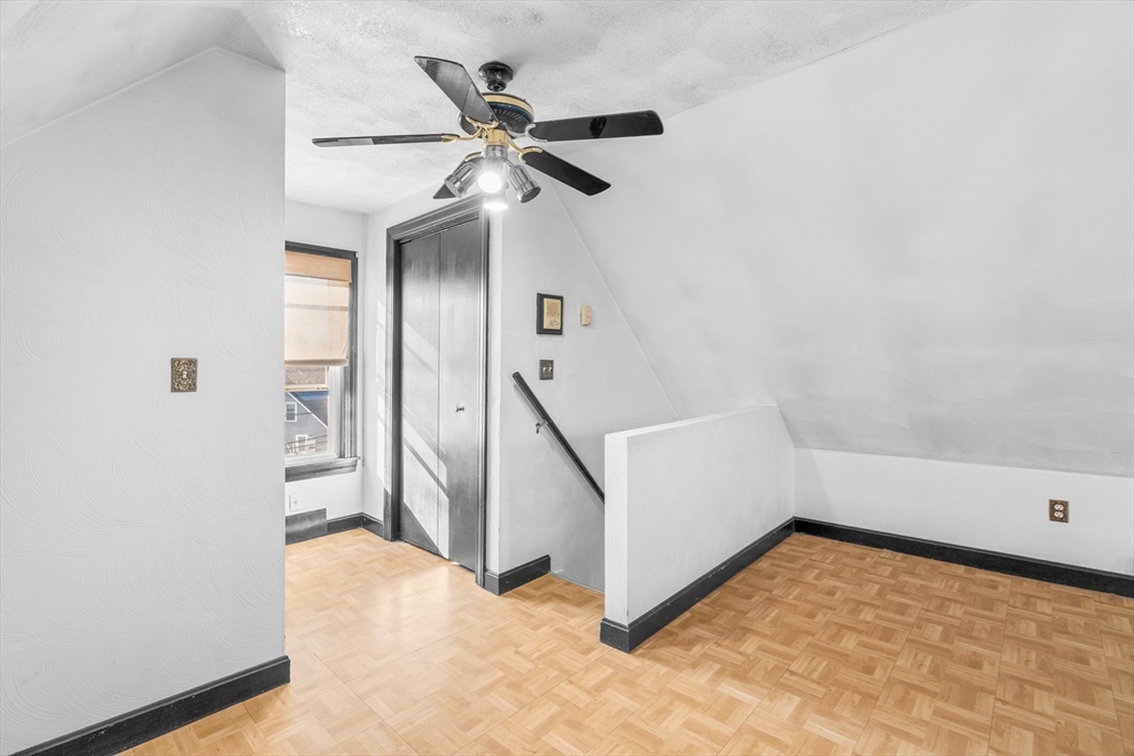 32 Beach Street Malden, MA 02148 - Photo 21 of 31 wooden floor in an empty room with a window