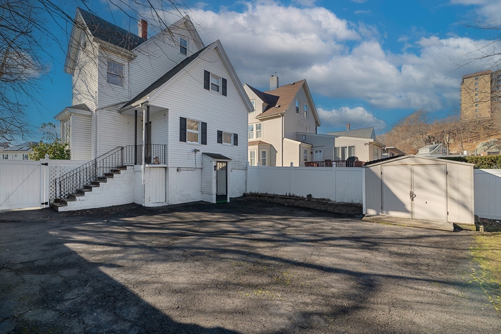 32 Beach Street Malden, MA 02148 - Photo 27 of 31 a view of a house with a snow on the road