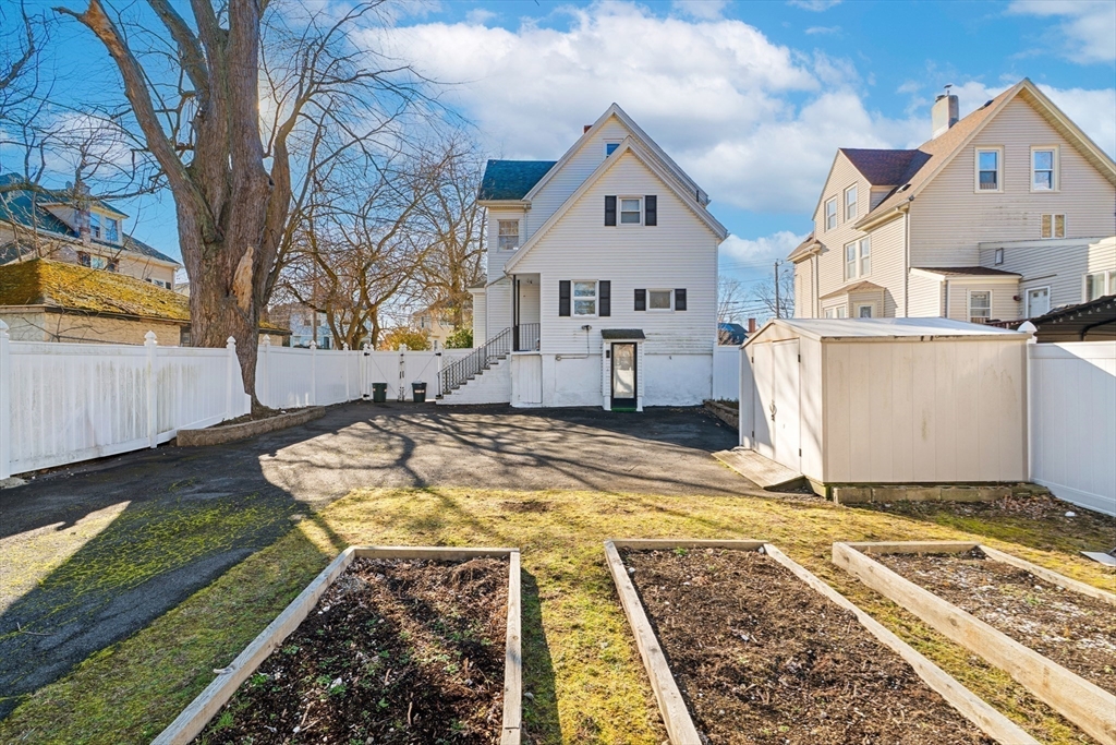 32 Beach Street Malden, MA 02148 - Photo 28 of 31 a view of a house with a yard