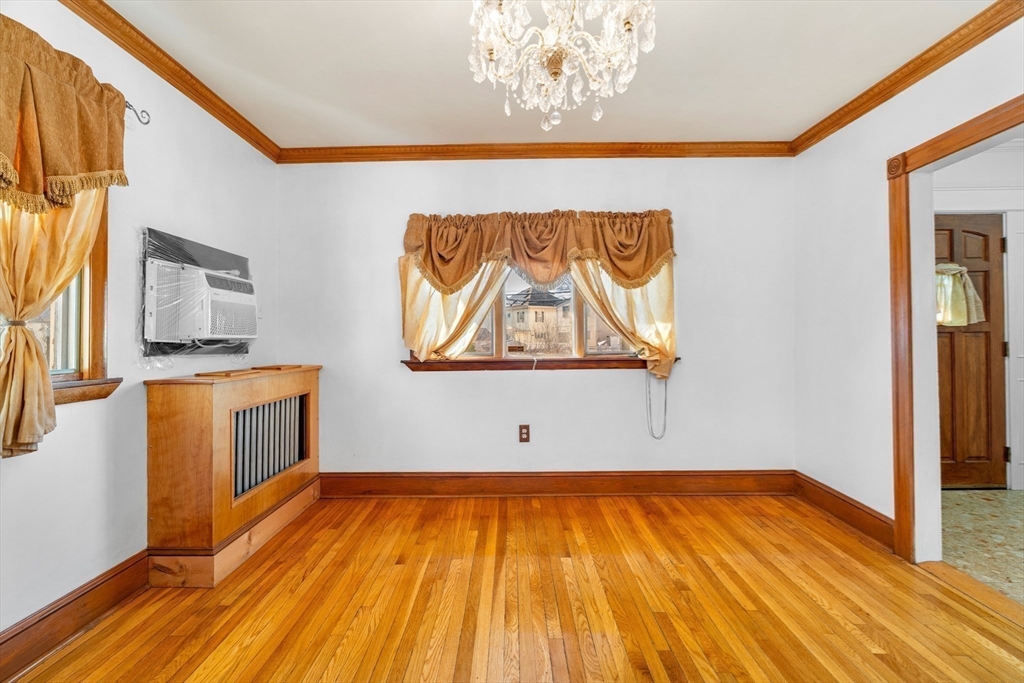 32 Beach Street Malden, MA 02148 - Photo 5 of 31 a view of a room with wooden floor