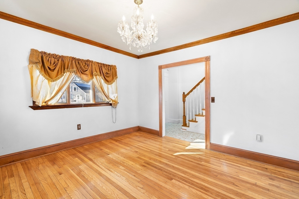 32 Beach Street Malden, MA 02148 - Photo 6 of 31 a view of empty room with wooden floor