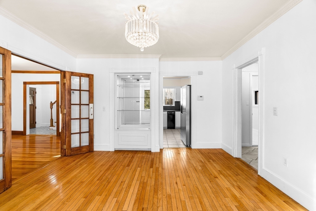 32 Beach Street Malden, MA 02148 - Photo 10 of 31 a view of a room with wooden floor and an empty room