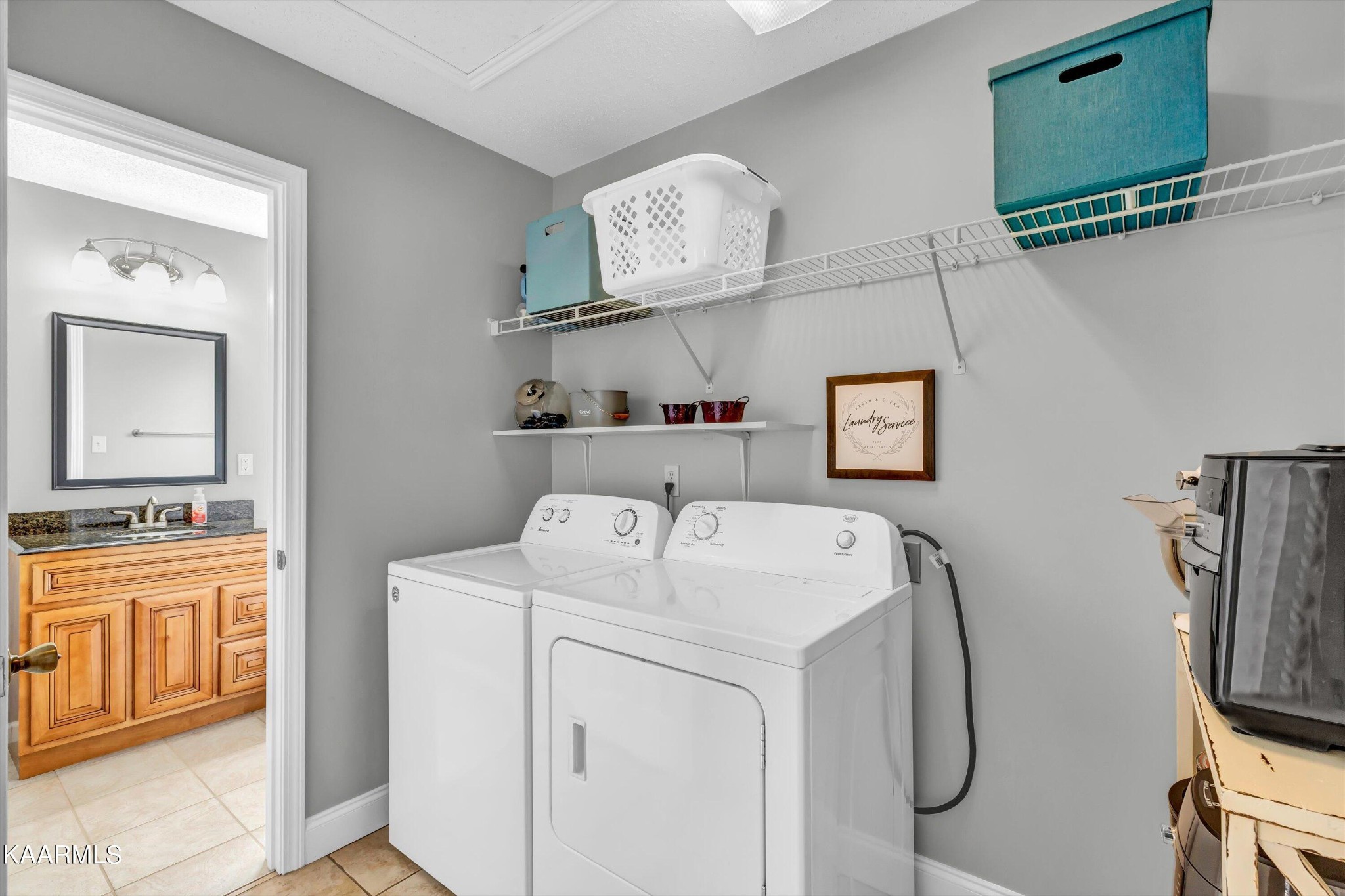 1433 Lambert Road Greenback, TN 37742 - Photo 15 of 34 a utility room with dryer washer and a view of living room
