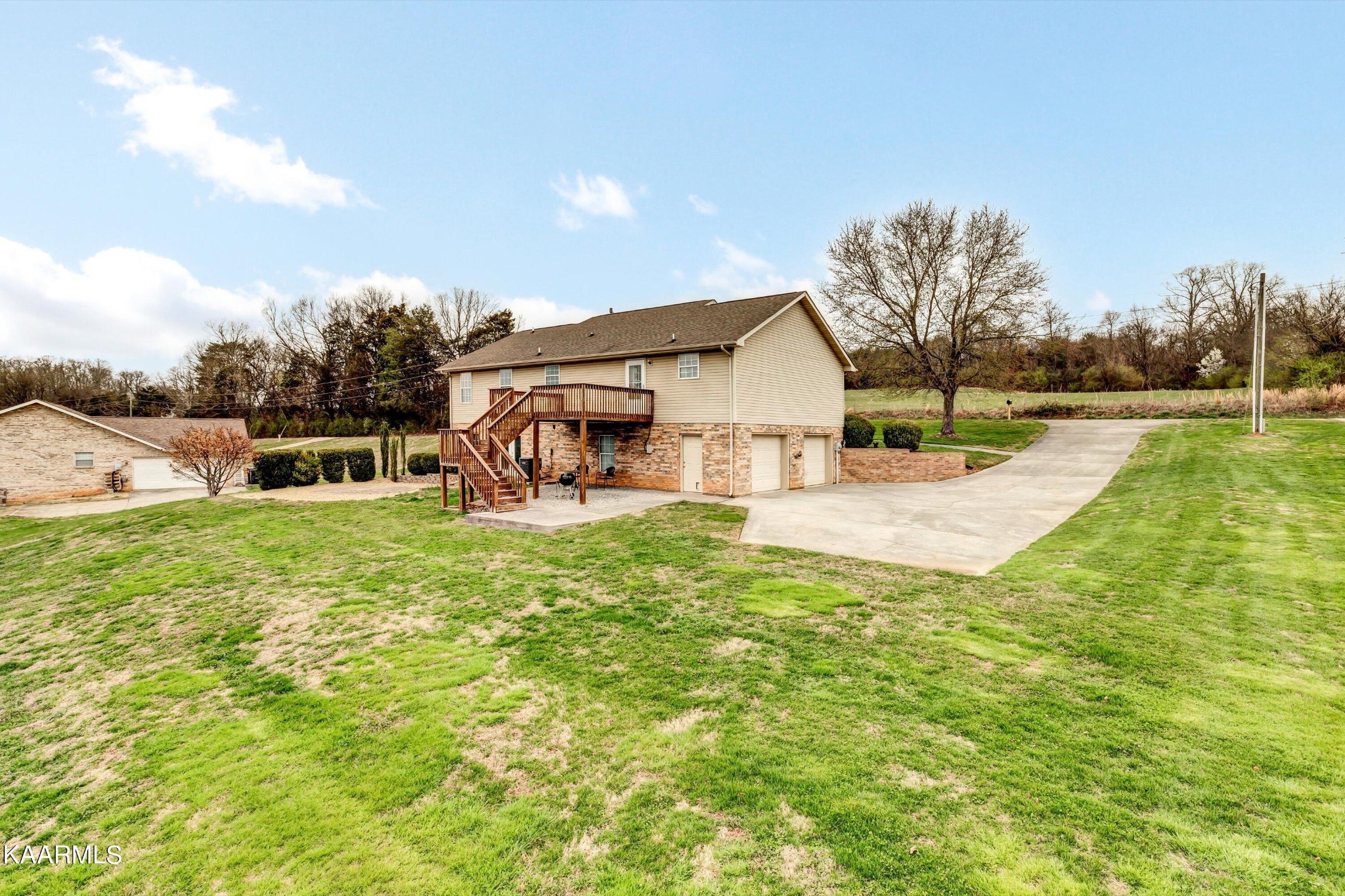 1433 Lambert Road Greenback, TN 37742 - Photo 31 of 34 a view of a house with a yard and sitting area