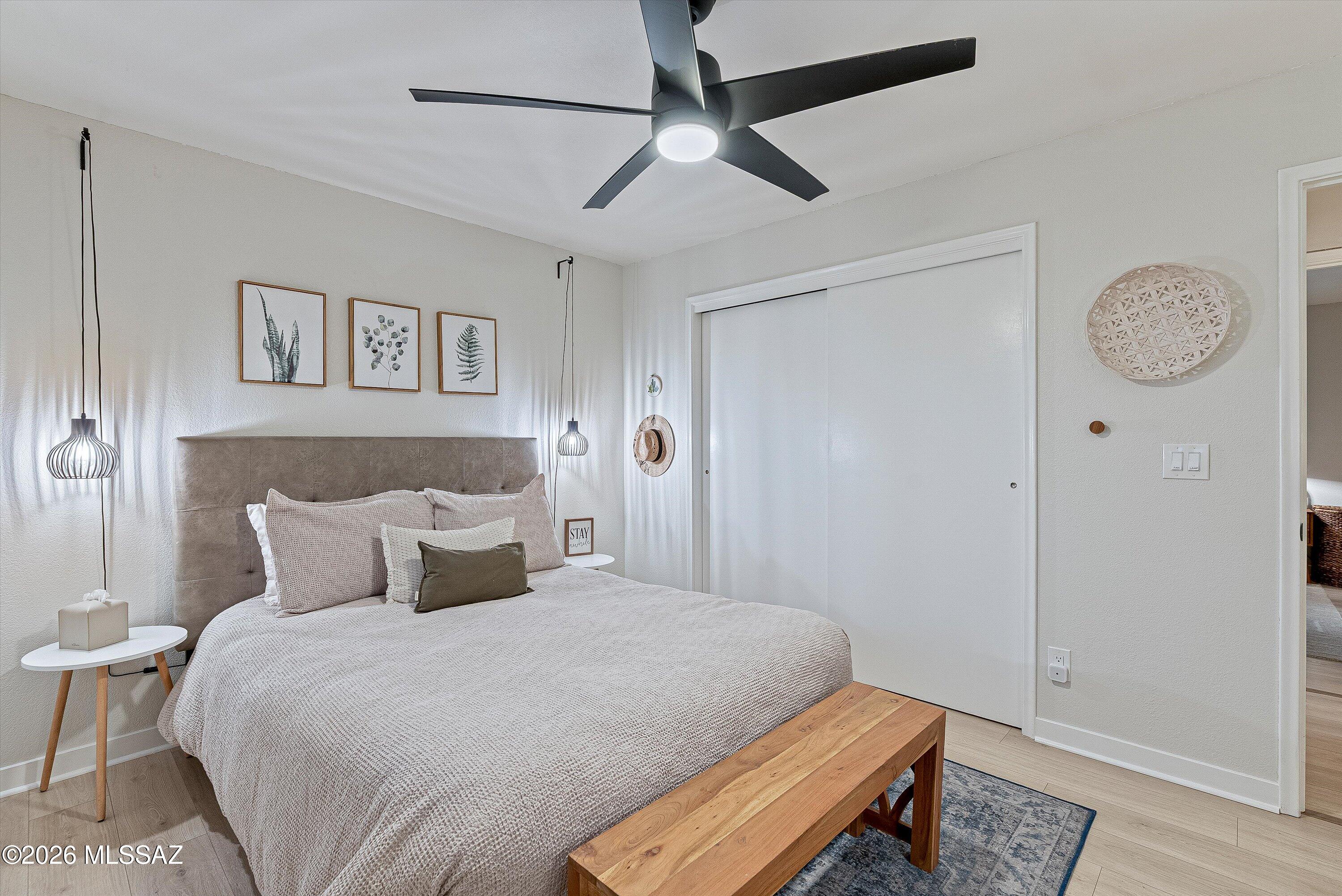 3949 West Mars Street Tucson, AZ 85741 - Photo 16 of 27 a bedroom with a bed and a table