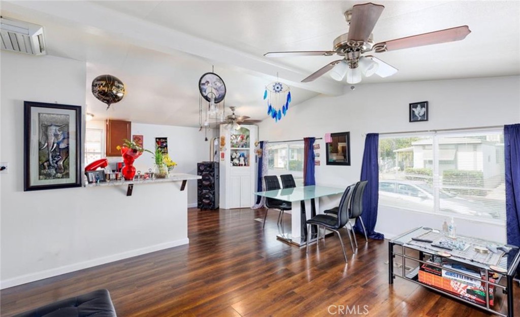 8450 G Avenue Hesperia, CA 92345 - Photo 2 of 10 a view of a dining room with furniture window and wooden floor