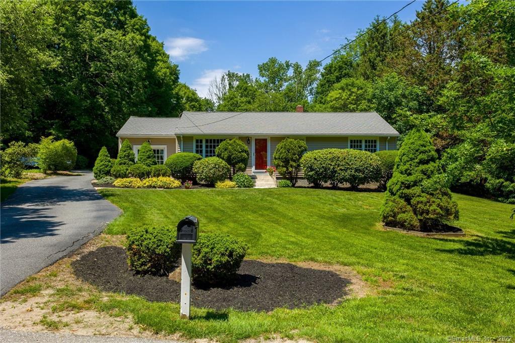 9 Freedley Road Pomfret, CT 06259 - Photo 1 of 1 a front view of a house with garden