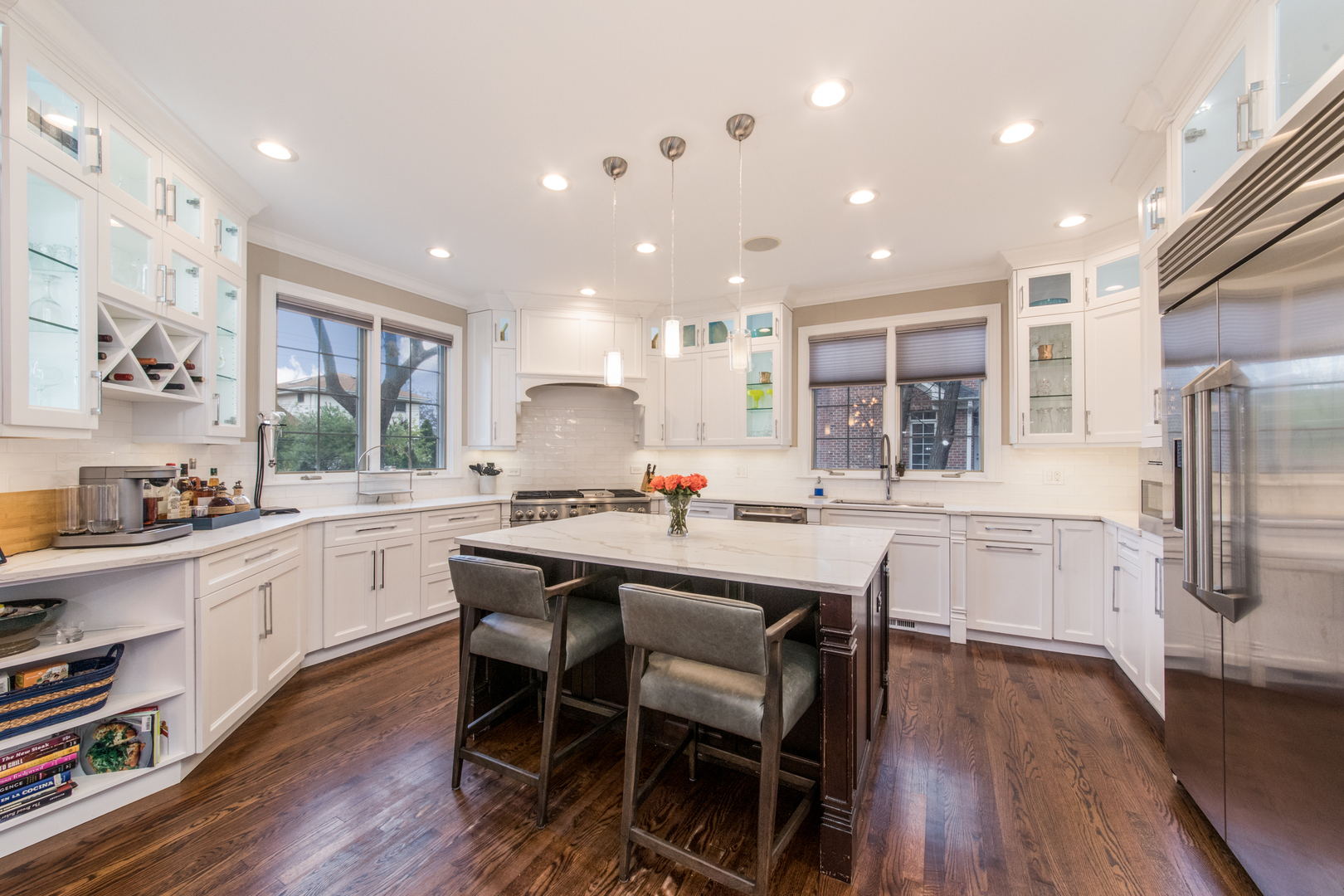 2360 Oak Tree Lane Park Ridge, IL 60068 - Photo 11 of 44 a kitchen with counter space dining table and wooden floor