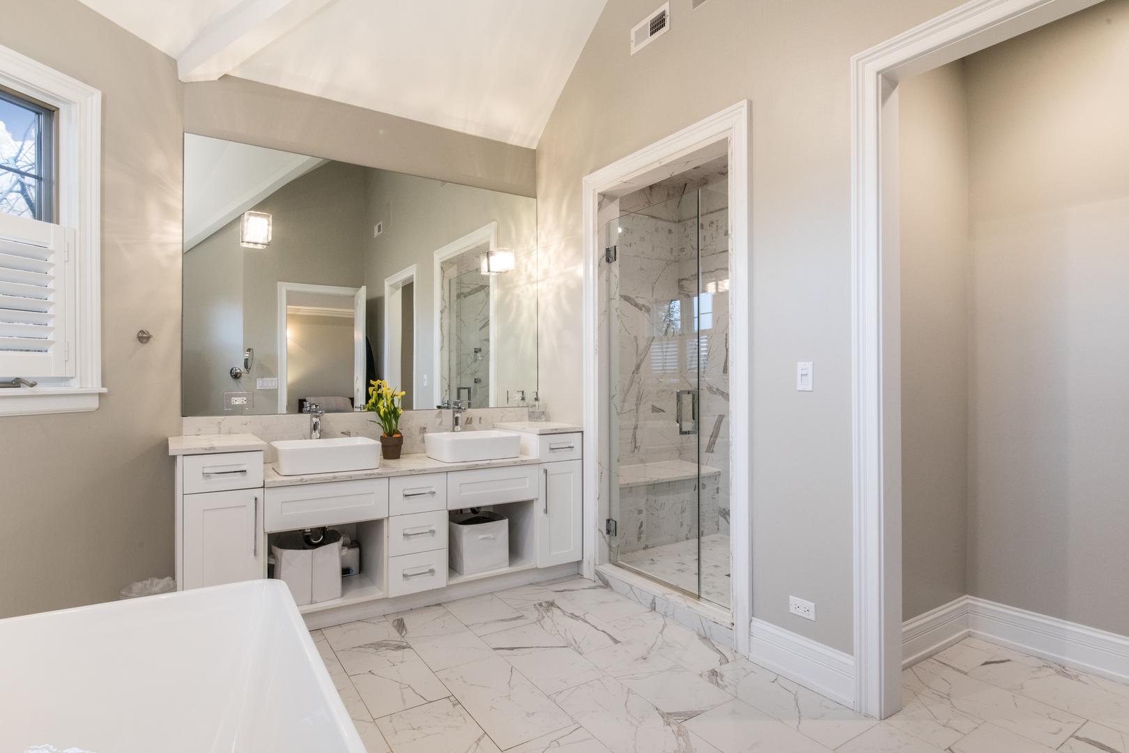 2360 Oak Tree Lane Park Ridge, IL 60068 - Photo 23 of 44 a large bathroom with a glass door shower and sink
