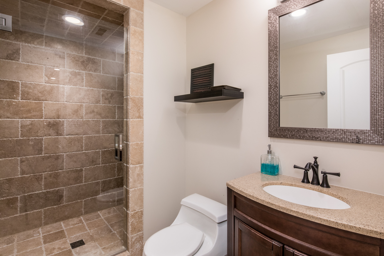 2360 Oak Tree Lane Park Ridge, IL 60068 - Photo 35 of 44 a bathroom with a granite countertop sink a toilet and a mirror