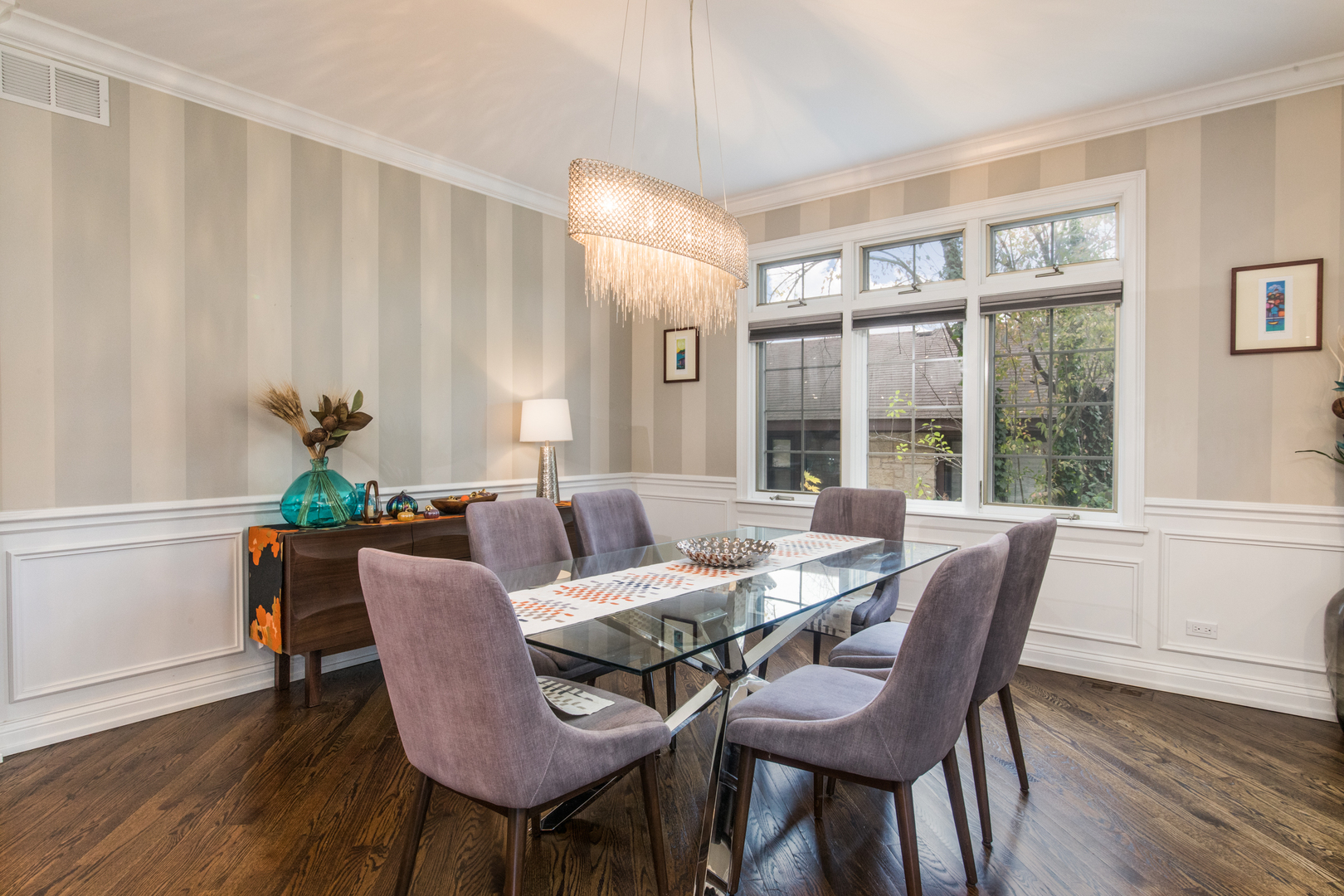 2360 Oak Tree Lane Park Ridge, IL 60068 - Photo 6 of 44 a view of a dining room with furniture a chandelier and wooden floor