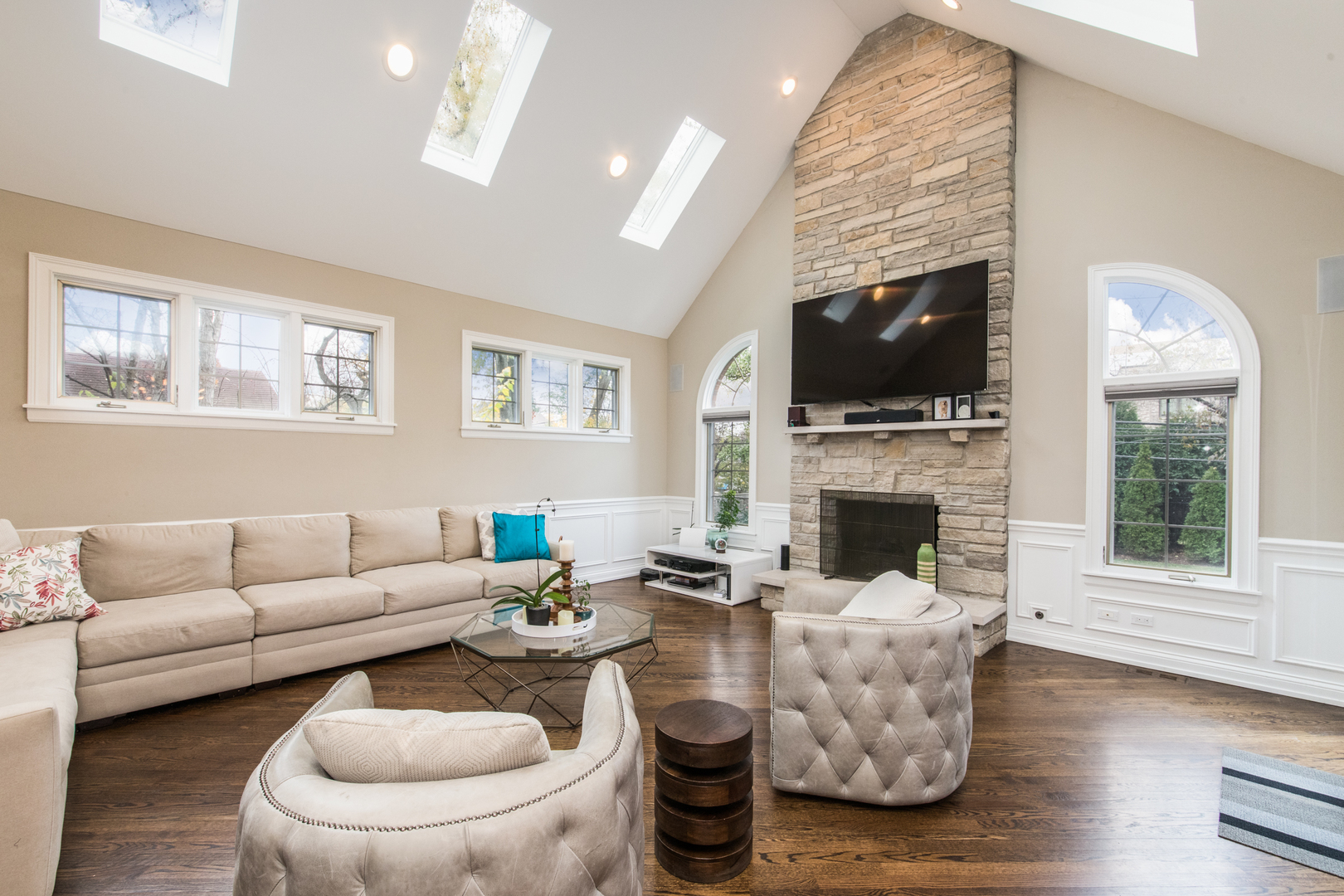 2360 Oak Tree Lane Park Ridge, IL 60068 - Photo 8 of 44 a living room with furniture a flat screen tv and a fireplace