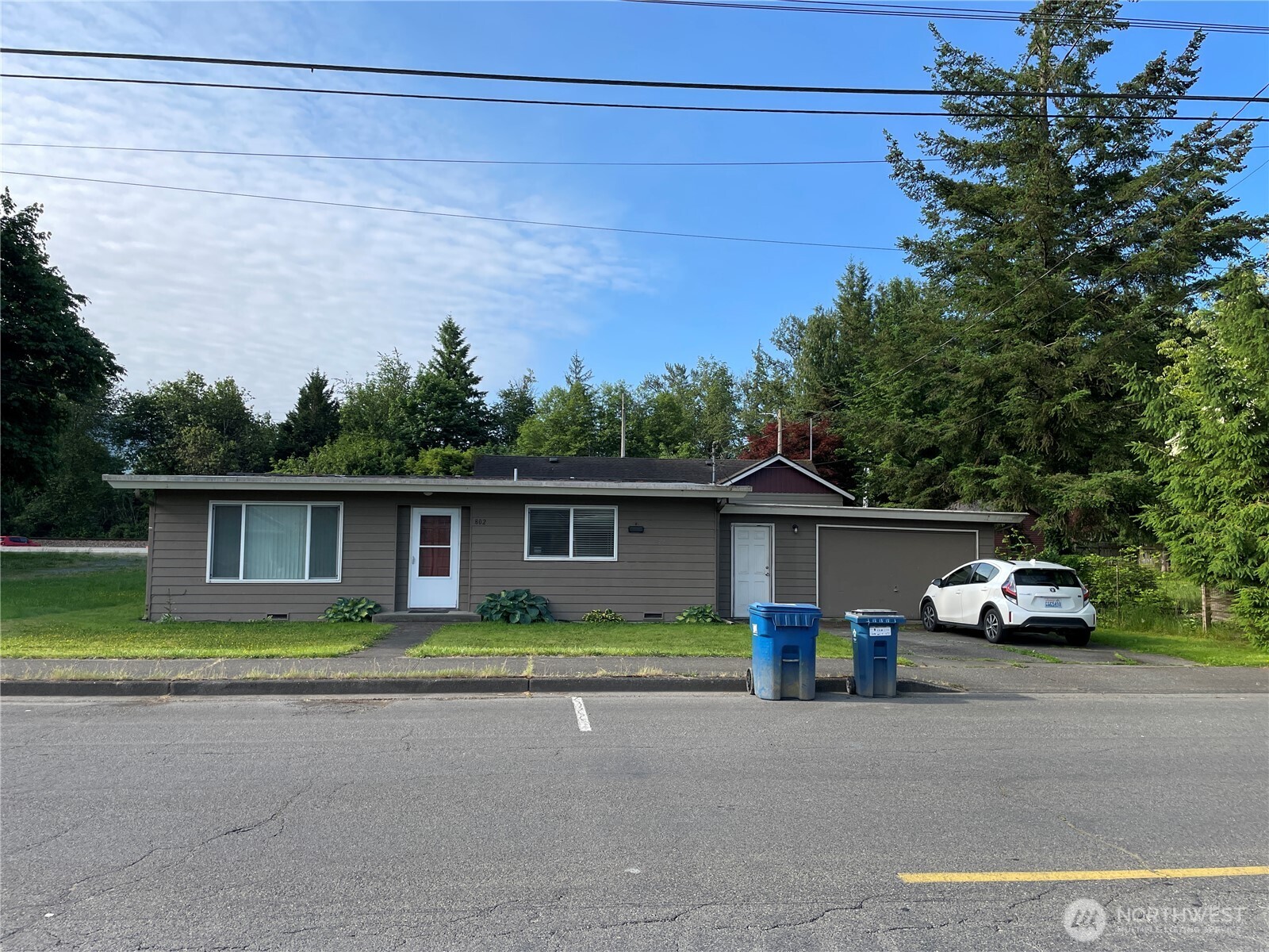 31503 Highway 2 Sultan, WA 98294 - Photo 12 of 12 a front view of a house with a yard and garage