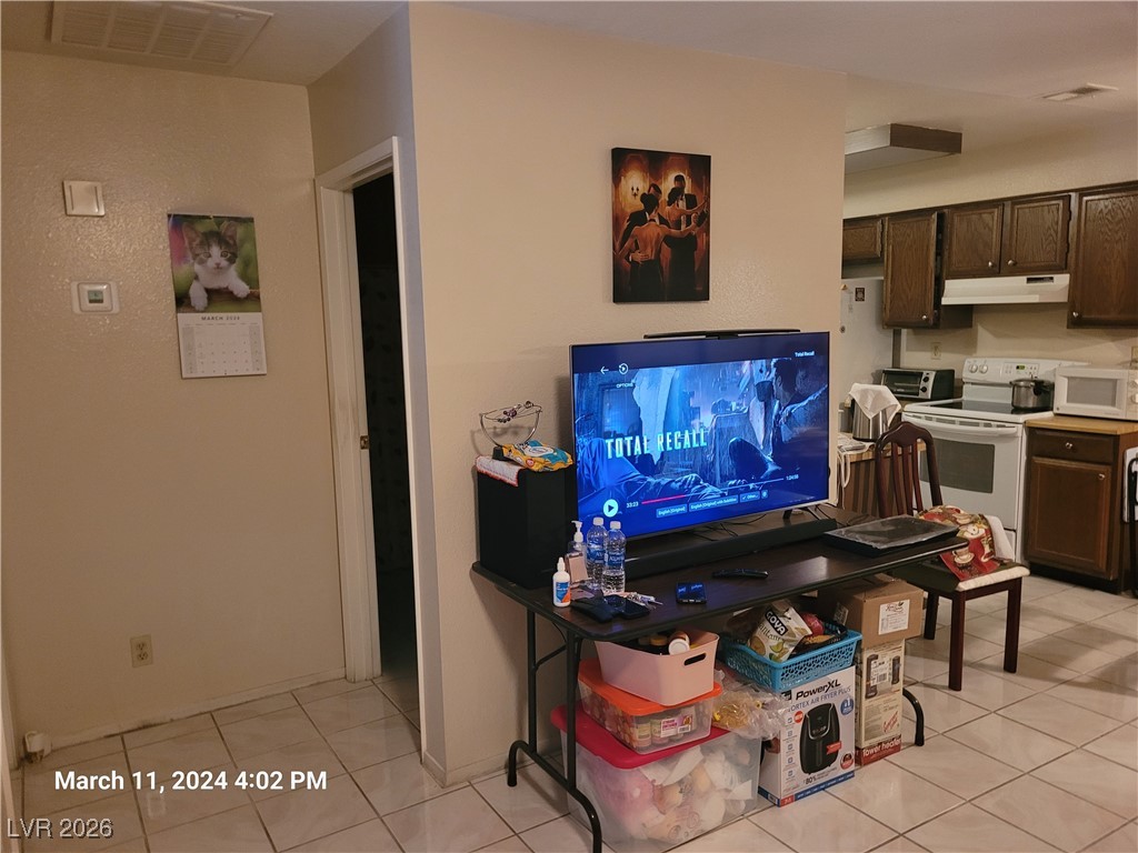 809 Hedge Way, Unit 3 Las Vegas, NV 89110 - Photo 4 of 10 Living area featuring light tile patterned floors