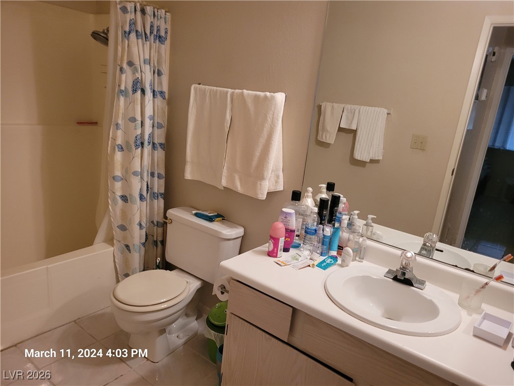 809 Hedge Way, Unit 3 Las Vegas, NV 89110 - Photo 7 of 10 Full bathroom with tile patterned floors, vanity, and shower / tub combo