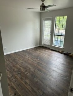 4520 Speedway, Unit A Austin, TX 78751 - Photo 5 of 18 Rich wood-inspired floors and a glass door highlight this versatile interior space.