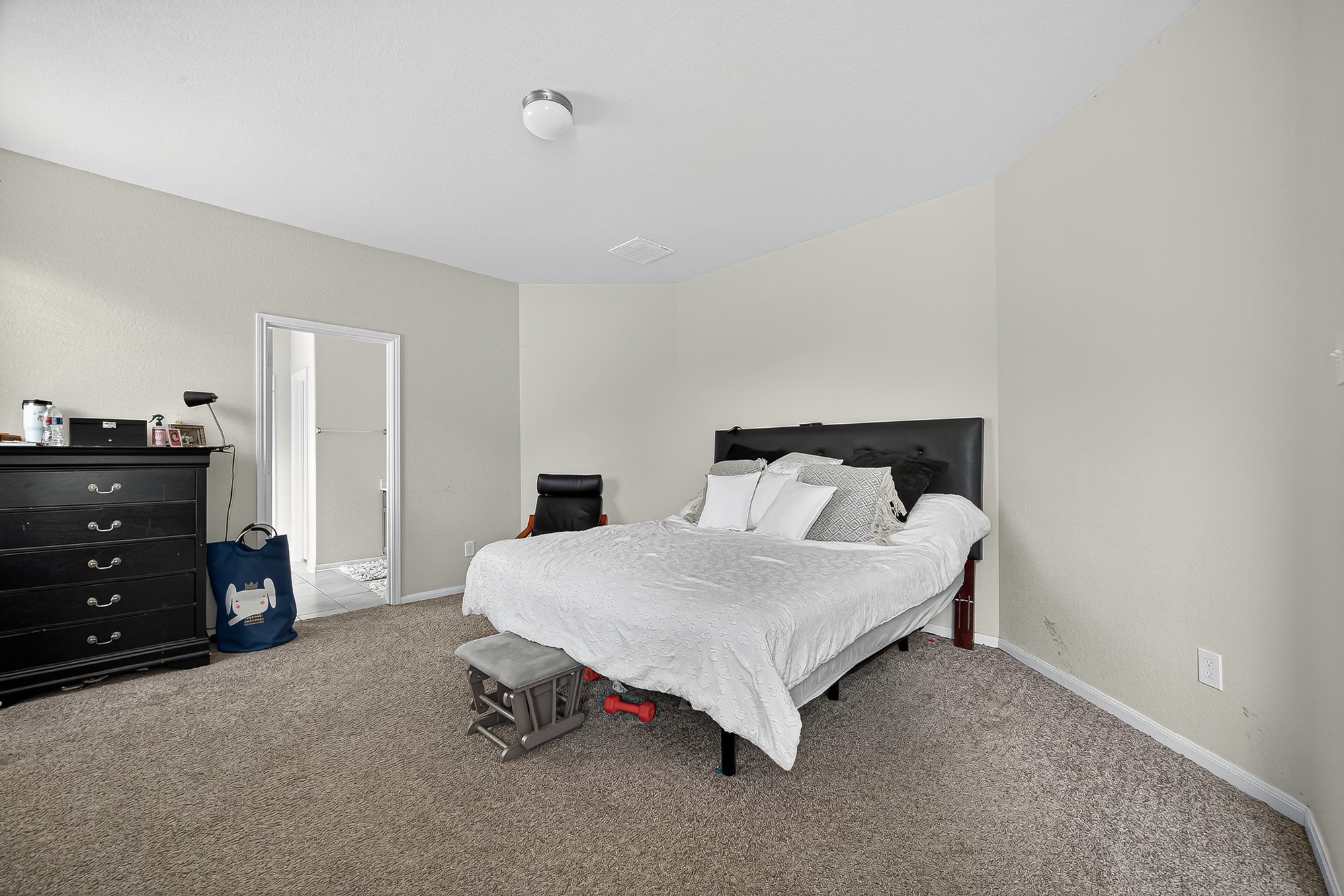 3035 Tandem Court Rosenberg, TX 77471 - Photo 13 of 28 a bedroom with a bed and dresser