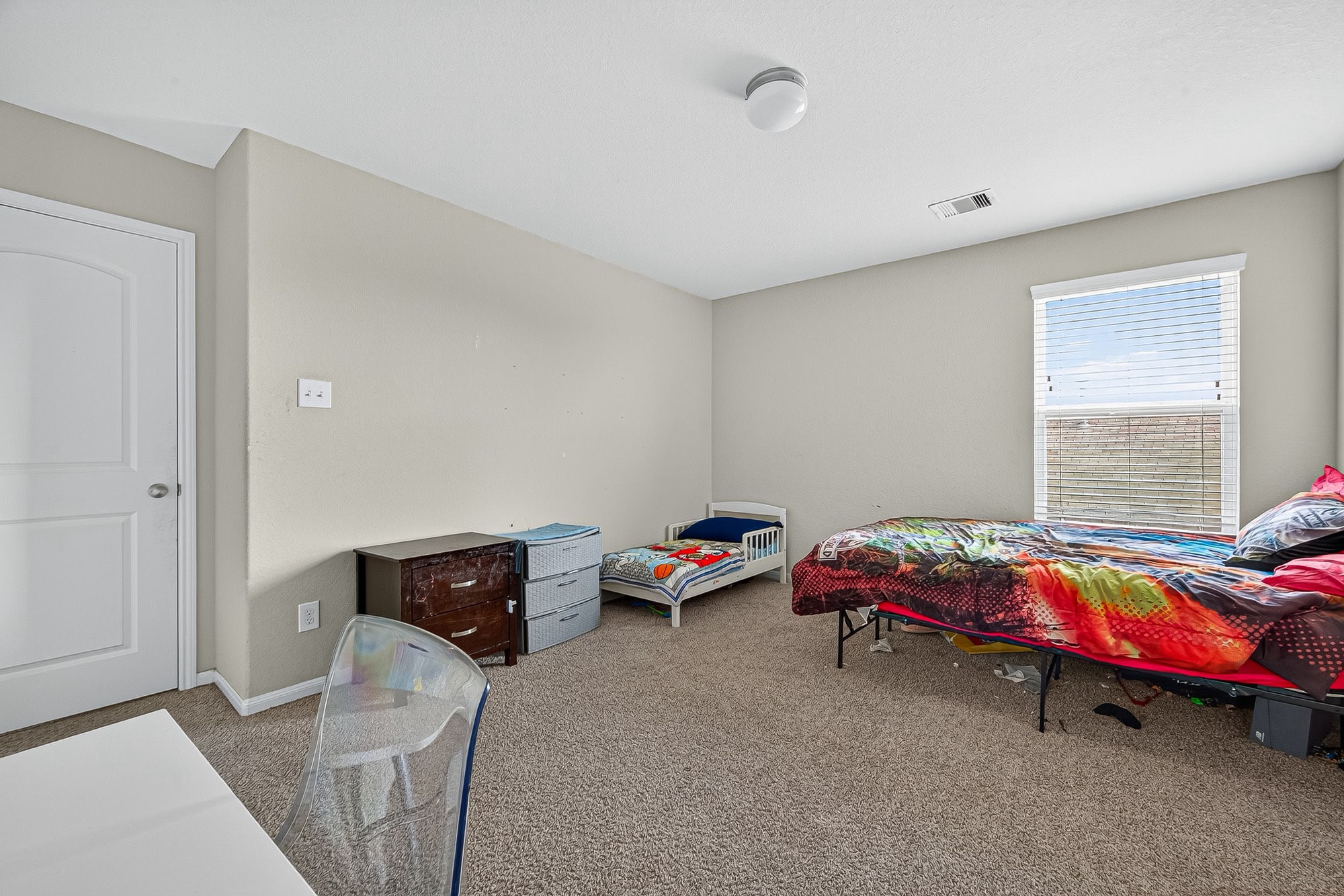 3035 Tandem Court Rosenberg, TX 77471 - Photo 24 of 28 a bedroom with a bed and a window