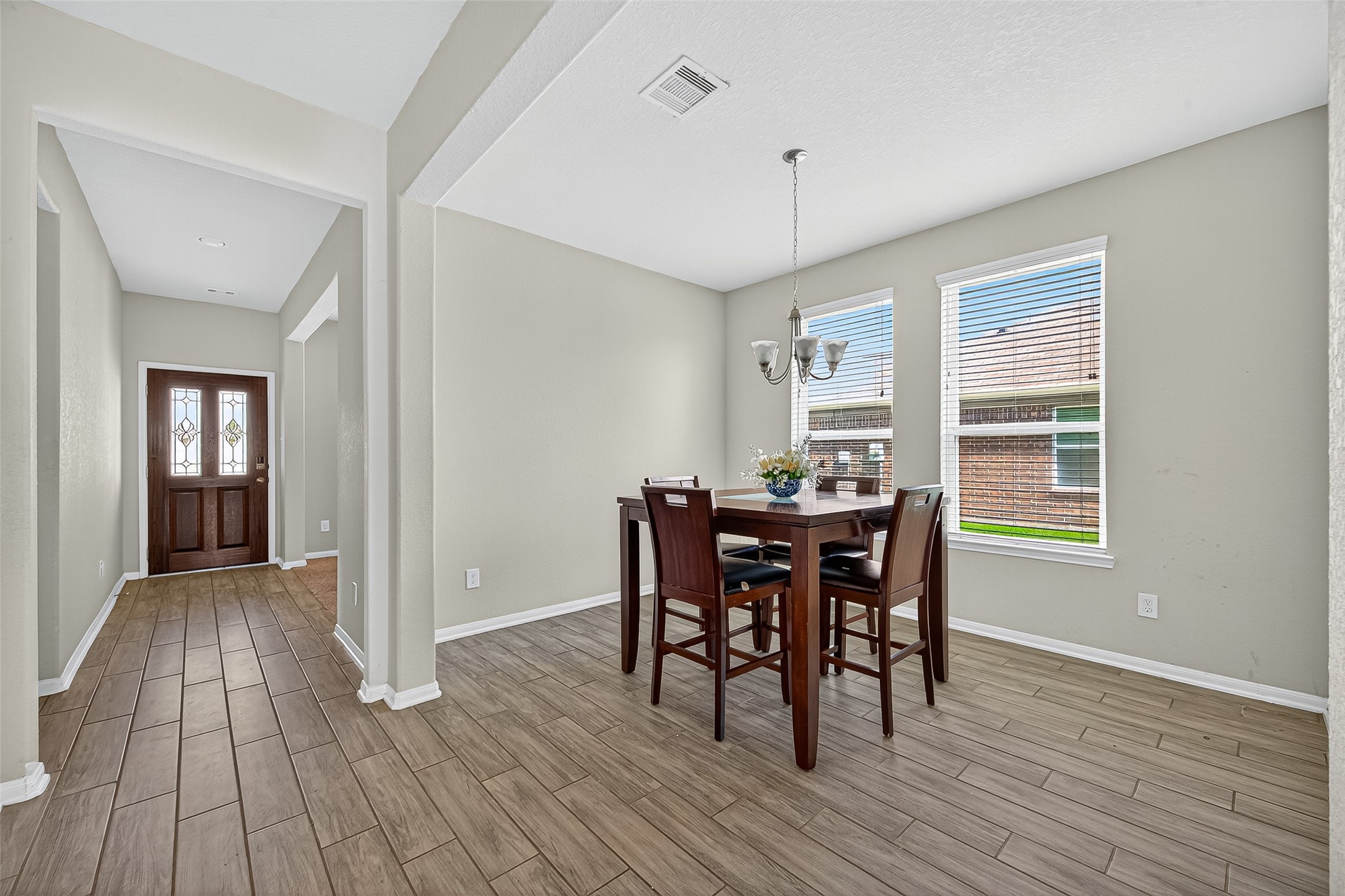 3035 Tandem Court Rosenberg, TX 77471 - Photo 7 of 28 a view of a dining room with furniture and wooden floor