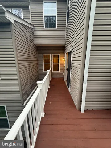 a view of a house with wooden stairs